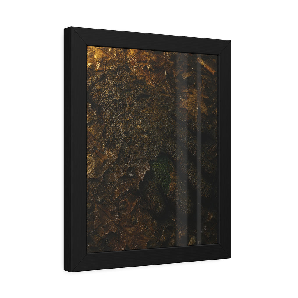 Wet mud and pressed oak leaves with a green scrap barely showing. The Reliquary of Mud and Leaf by Garabaggio, framed fine art print hanging in a room.