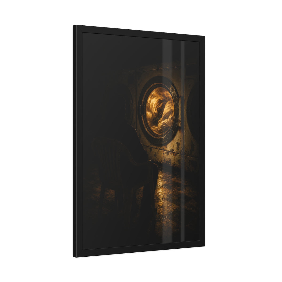 A person seated in a plastic chair facing a lit dryer drum. The Watcher in the Plastic Chair by Garabaggio, framed fine art print hanging in a room.
