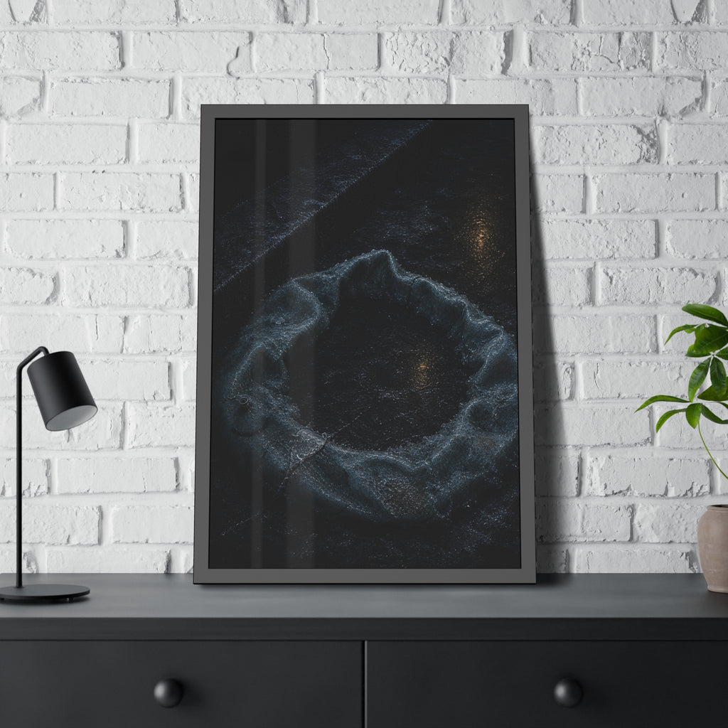 A deflated ring float collapsed on wet pavement under distant amber light. The Freezing of the Smile by Garabaggio, framed fine art print hanging in a room.
