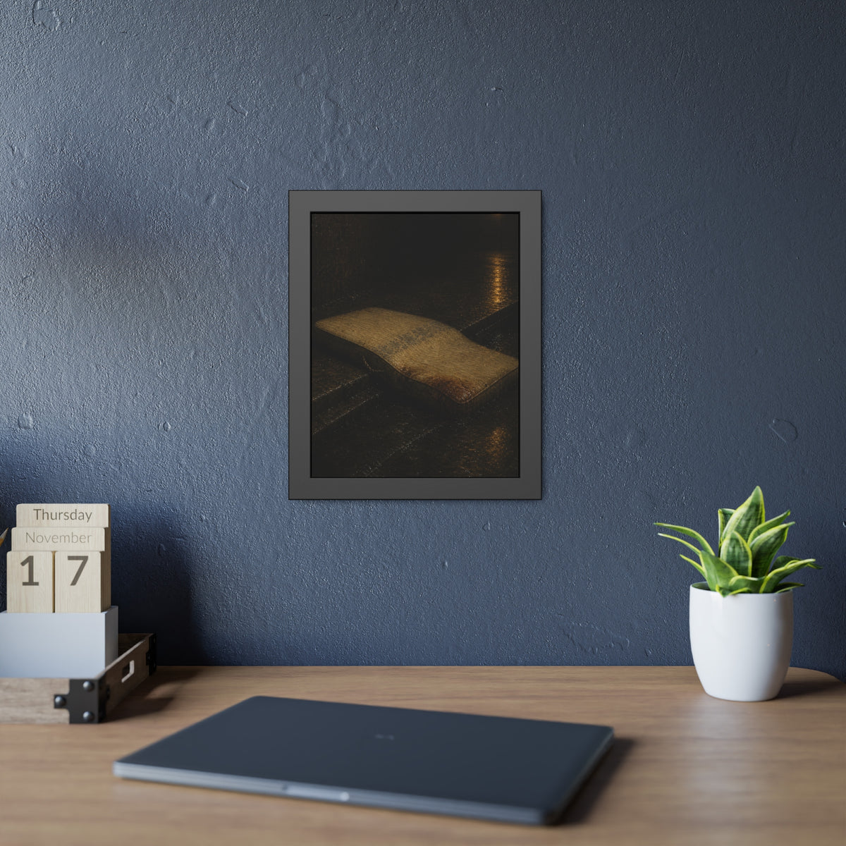 A sodden mattress slumped off a curb on wet pavement under a street lamp. The Collapse into the Gutter by Garabaggio, framed fine art print hanging in a room.