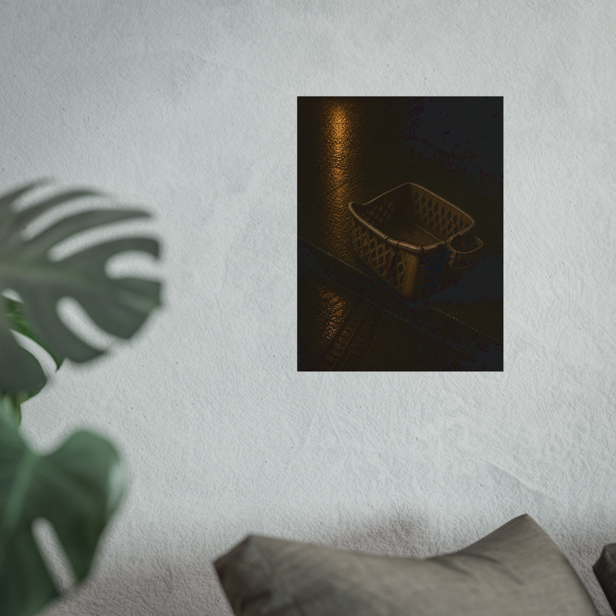 A cracked plastic laundry basket with a warped rim on wet asphalt. The Crushing of the Rim by Garabaggio, fine art print hanging in a room.