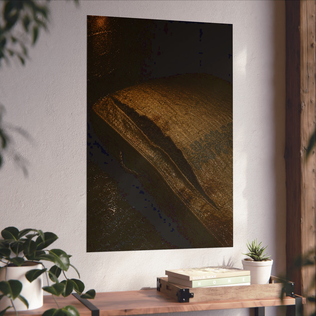 A mattress with its seam split open, lit warm against a dark wall. The Opening of the Ticking by Garabaggio, fine art print hanging in a room.