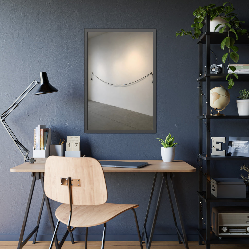 An extension cord hung in a long slack curve across a bare white wall. The Unplugged Line by Garabaggio, framed fine art print hanging in a room.