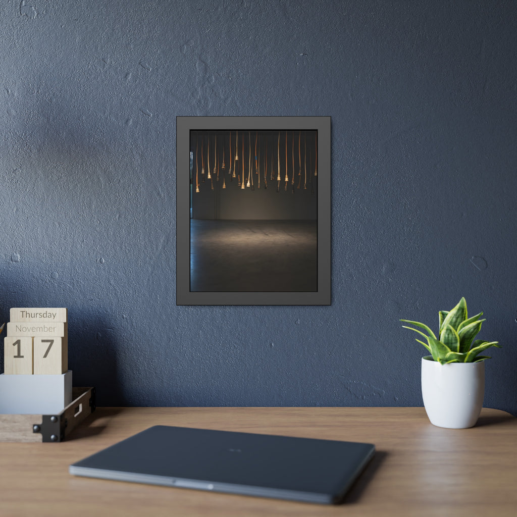 Extension cords hanging plug down from a ceiling in a dim room. All Ends, No Source by Garabaggio, framed fine art print hanging in a room.