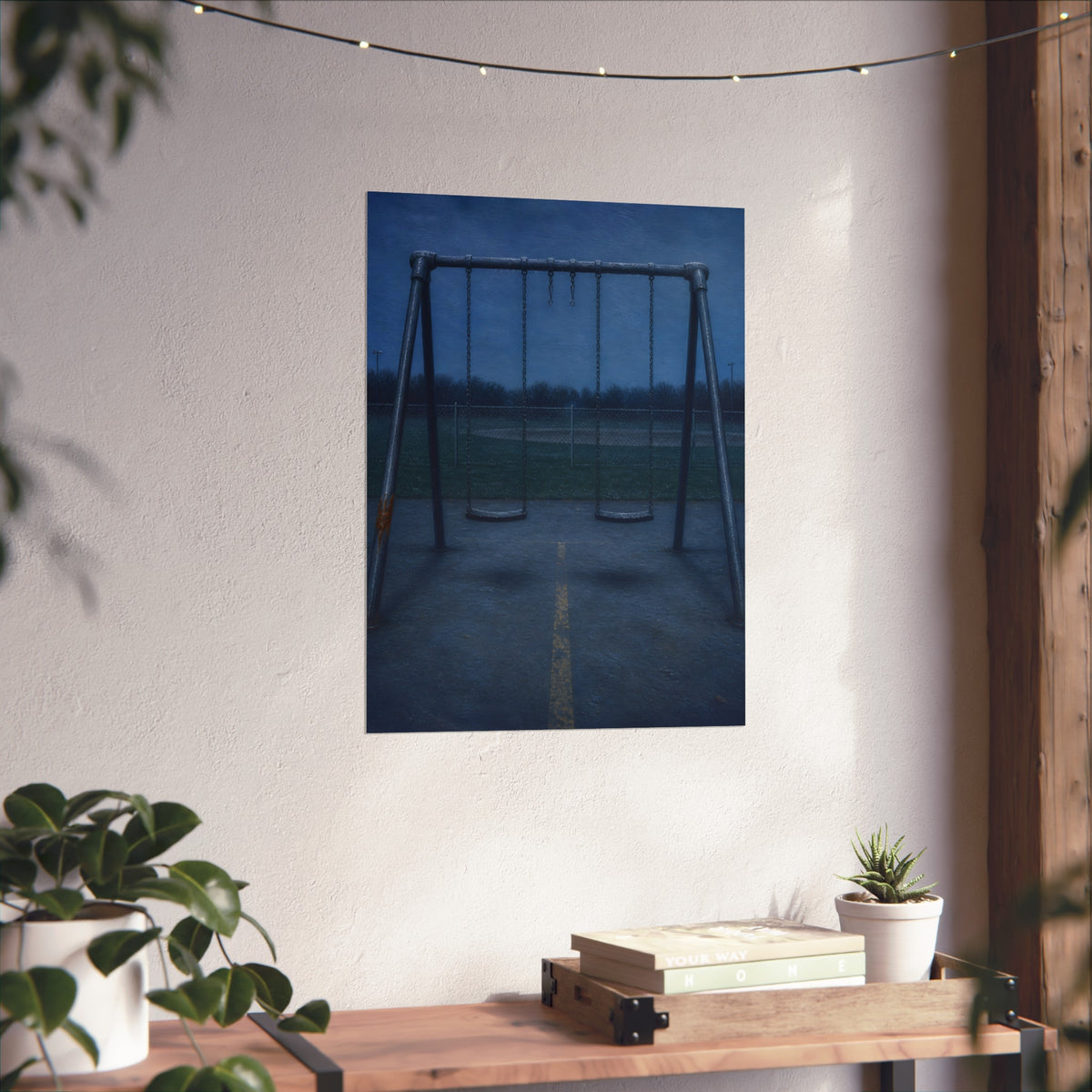 A swing set at dusk with two seats hanging straight. The Sixth Hour: The Seat Hanging Straight by Garabaggio, fine art print hanging in a room.