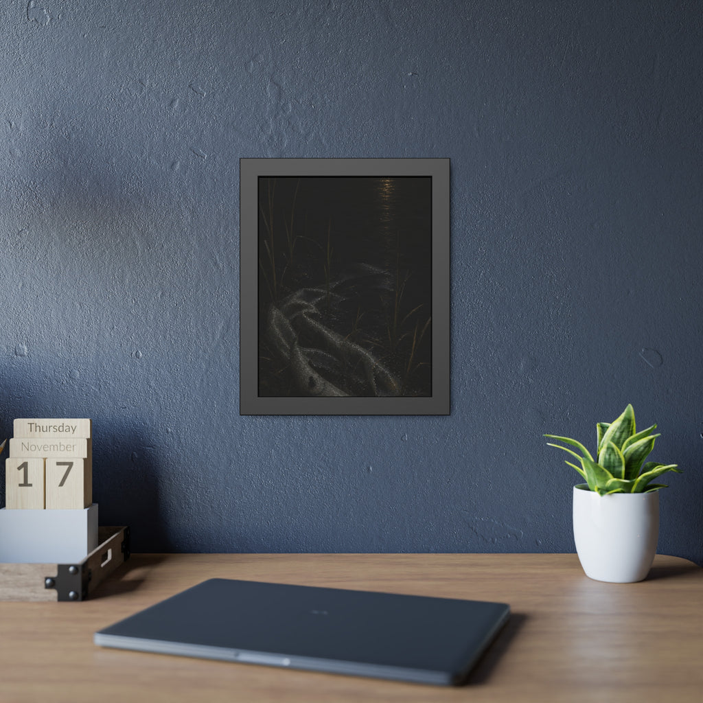 A deflated float slumped in lakeside reeds under a streak of moonlight. Spring Skin in the Reeds by Garabaggio, framed fine art print hanging in a room.