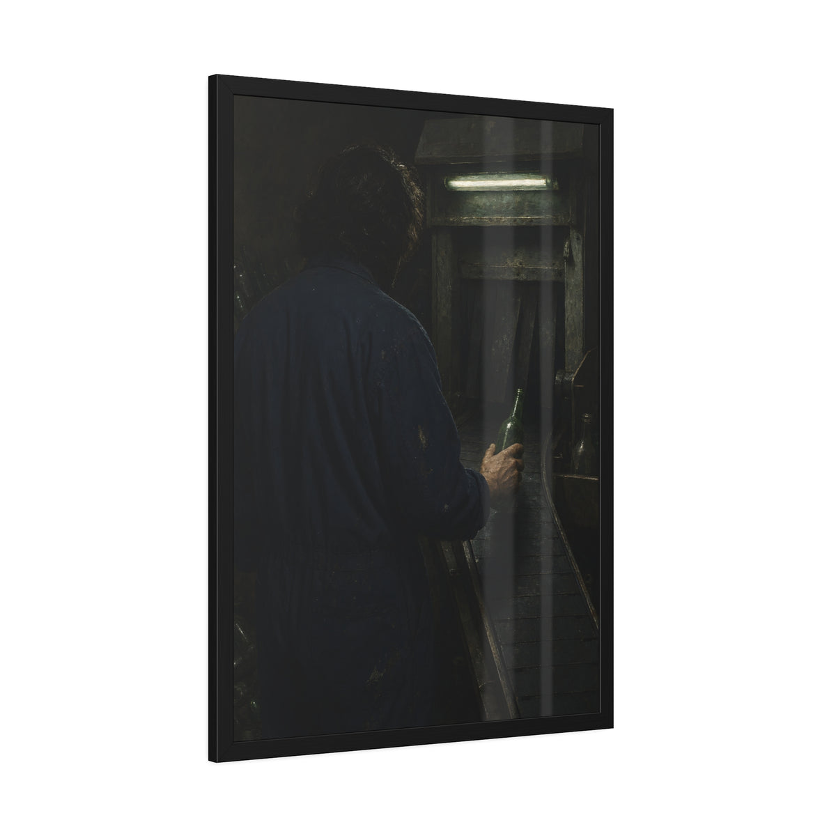 A man in coveralls sets a green bottle on a conveyor under a strip light. Garabaggio at the Conveyor by Garabaggio, framed fine art print hanging in a room.