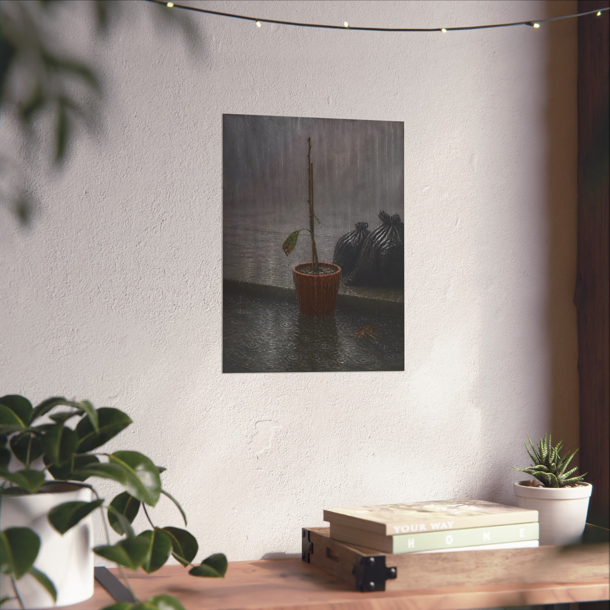 A bare stick in a clay pot on a curb in heavy rain beside trash bags. The Second Rain by Garabaggio, fine art print hanging in a room.