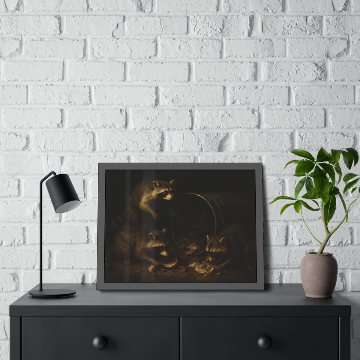 Raccoons at a tipped metal pail, one gnawing a melon rind in the dark. The Supper at the Alleyway by Garabaggio, framed fine art print hanging in a room.
