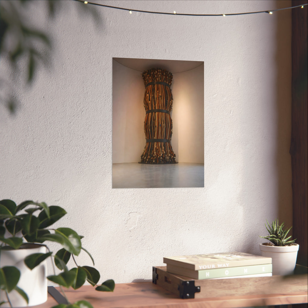 A tall column of bundled cords strapped in three places in a gallery corner. The Bundled Apse by Garabaggio, fine art print hanging in a room.