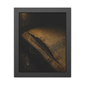 A mattress with its seam split open, lit warm against a dark wall. The Opening of the Ticking by Garabaggio, framed fine art print, 11″ x 14″.