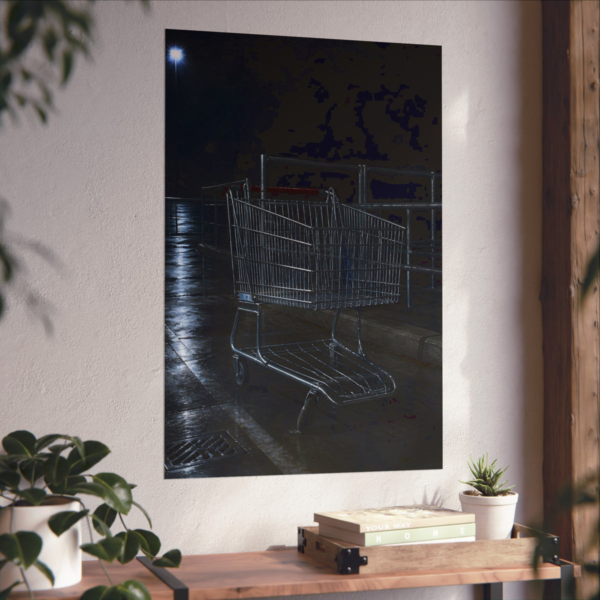 A shopping cart beside its corral on wet asphalt under a lot light. The Cart at the Corral by Garabaggio, fine art print hanging in a room.