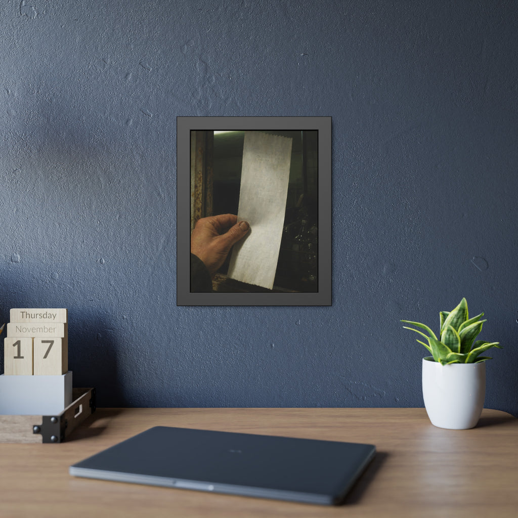 A hand holding a blank slip at a rusted counter window, bottles behind. The Receipt of Absolution by Garabaggio, framed fine art print hanging in a room.