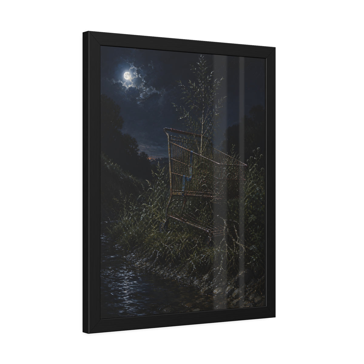 A shopping cart in creekside weeds with a sapling growing up through it. The Cart Grown Through by Garabaggio, framed fine art print hanging in a room.
