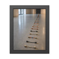 A long line of cut extension cord ends laid across a pale gallery floor. The Severed Procession by Garabaggio, framed fine art print, 11″ x 14″.