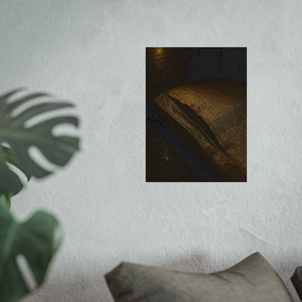 A mattress with its seam split open, lit warm against a dark wall. The Opening of the Ticking by Garabaggio, fine art print hanging in a room.
