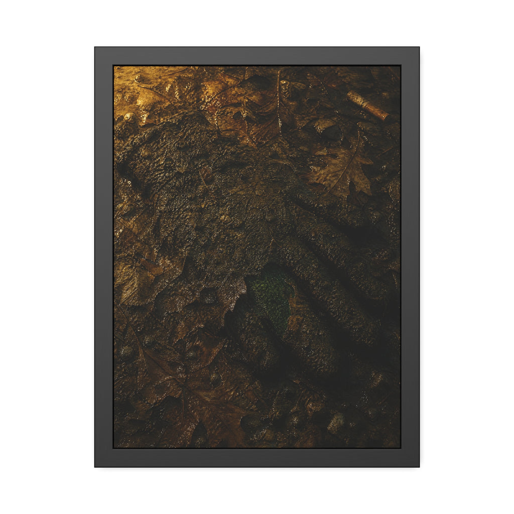 Wet mud and pressed oak leaves with a green scrap barely showing. The Reliquary of Mud and Leaf by Garabaggio, framed fine art print hanging in a room.