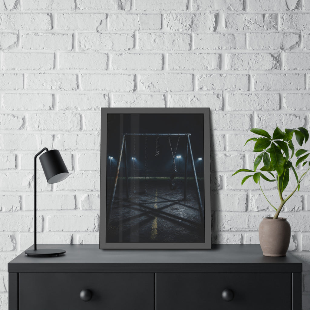 An empty swing set at night with field lights glowing behind it. The Ninth Hour: The Seat Still Moving by Garabaggio, framed fine art print hanging in a room.