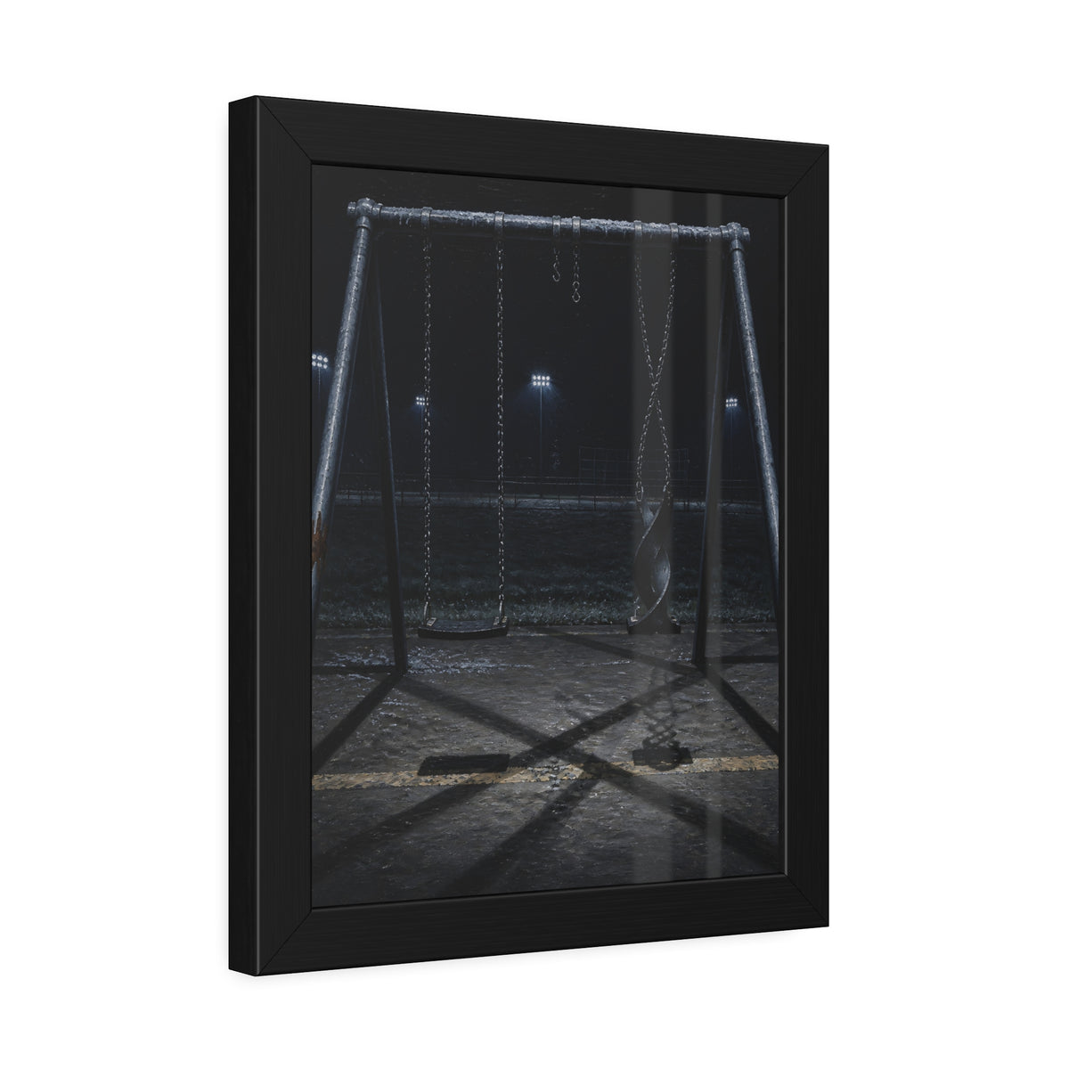 An empty swing set at night with one seat twisted up on its chains. The First Hour: The Twisted Seat by Garabaggio, framed fine art print hanging in a room.