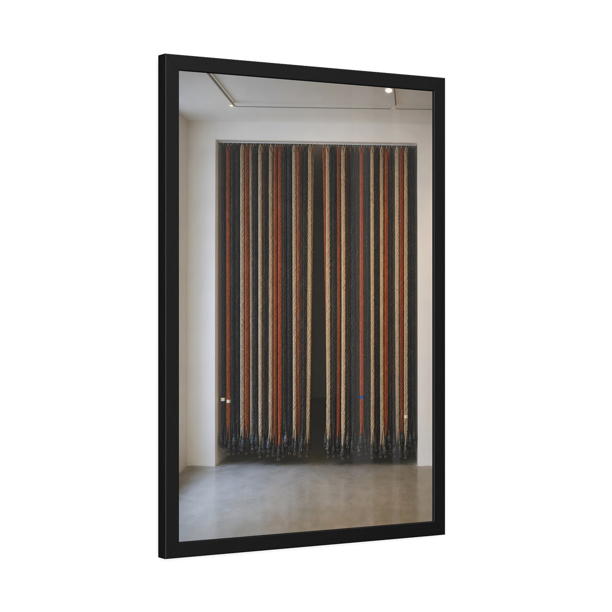 Hundreds of extension cords hung floor to ceiling across a bright white room. The Cord Curtain by Garabaggio, framed fine art print hanging in a room.