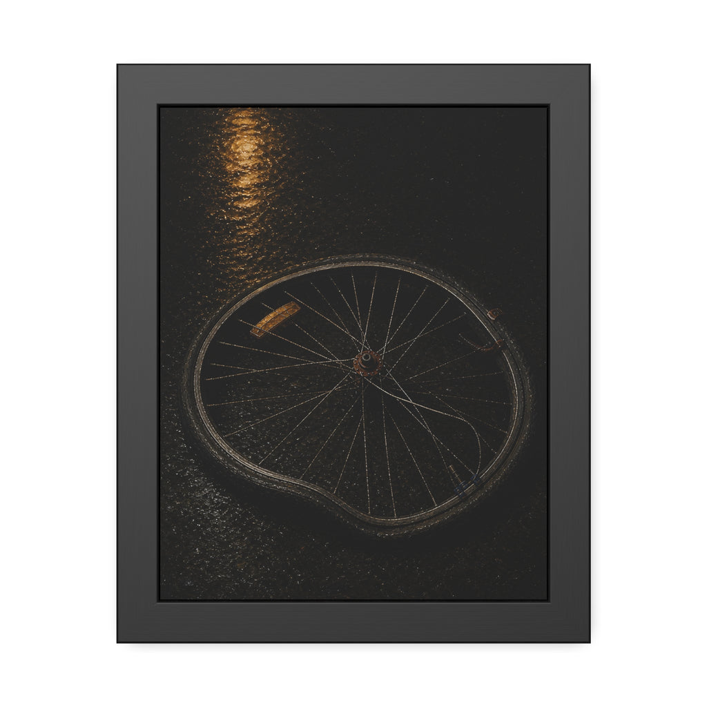 A buckled bicycle wheel on wet asphalt beneath a streetlight reflection. The Bend from Impact by Garabaggio, framed fine art print, 11″ x 14″.