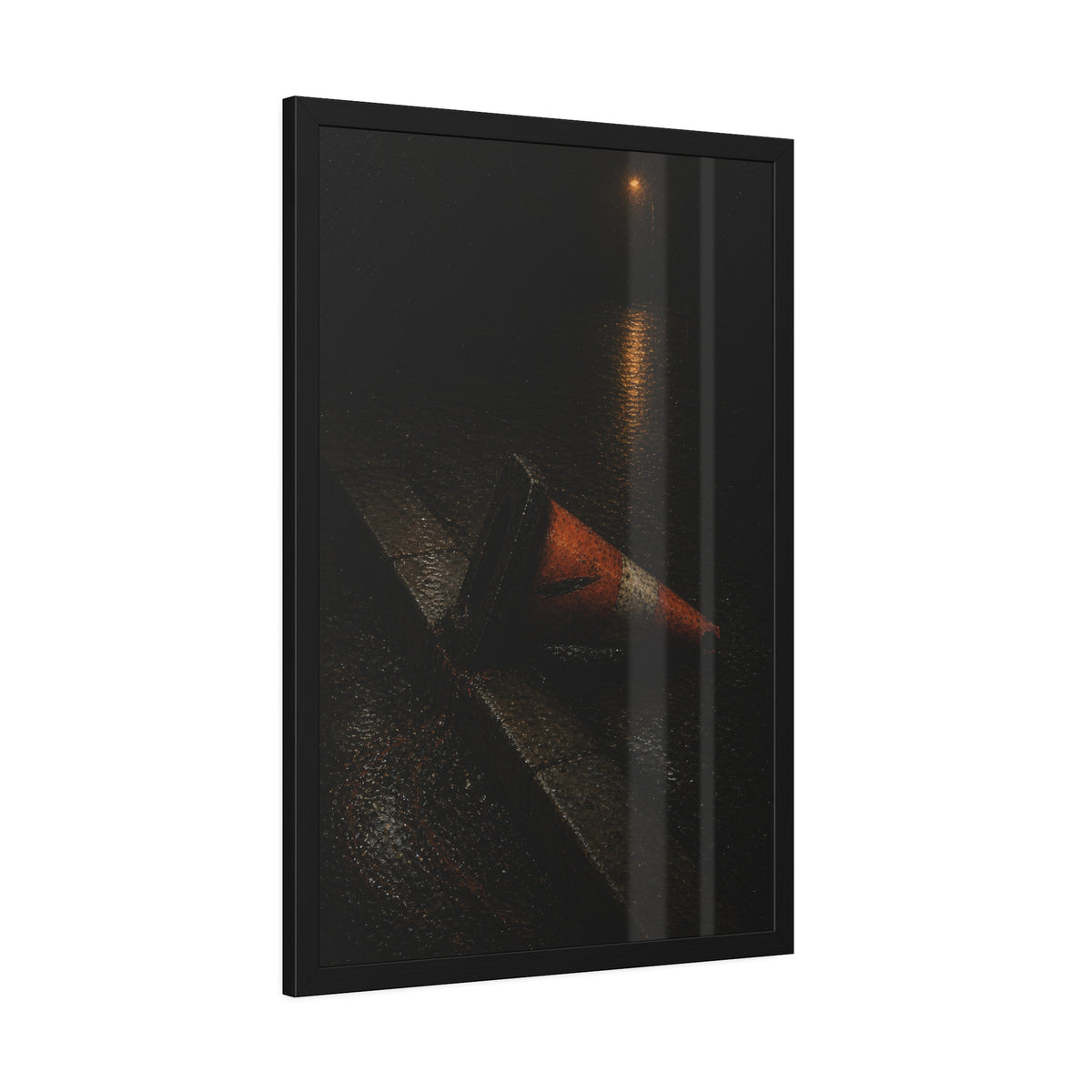 An orange traffic cone toppled on a wet curb under a distant streetlamp. The Dragging Through Rain by Garabaggio, framed fine art print hanging in a room.