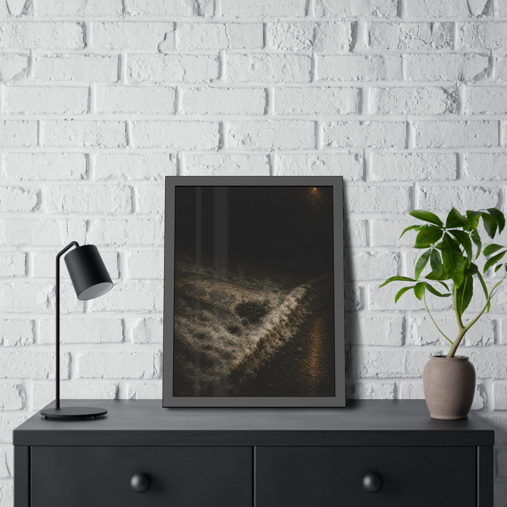 A discarded mattress half buried in snow, a distant streetlight behind. The White Burial by Garabaggio, framed fine art print hanging in a room.