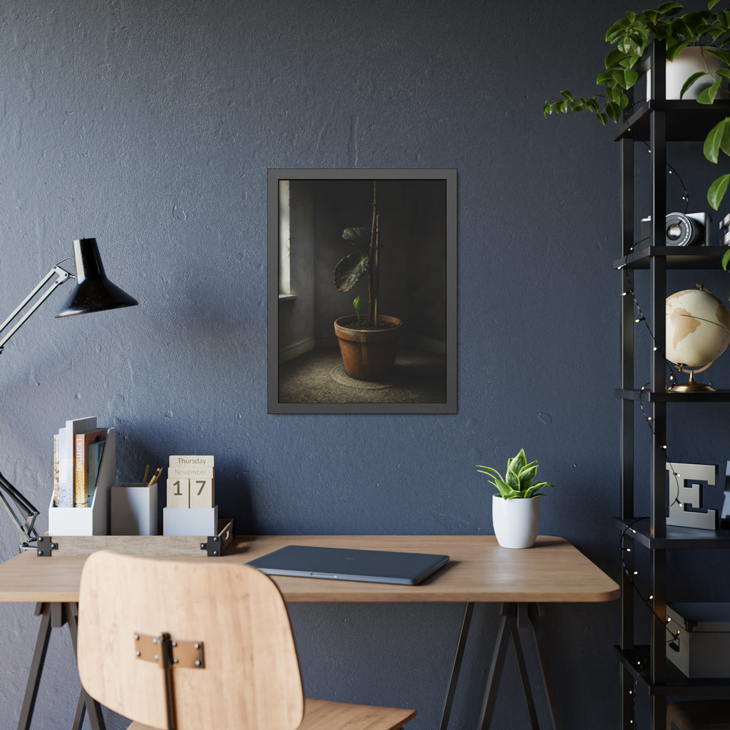 A potted plant down to two curled leaves and one new sprout by a window. The Corner by the Window Again by Garabaggio, framed fine art print hanging in a room.
