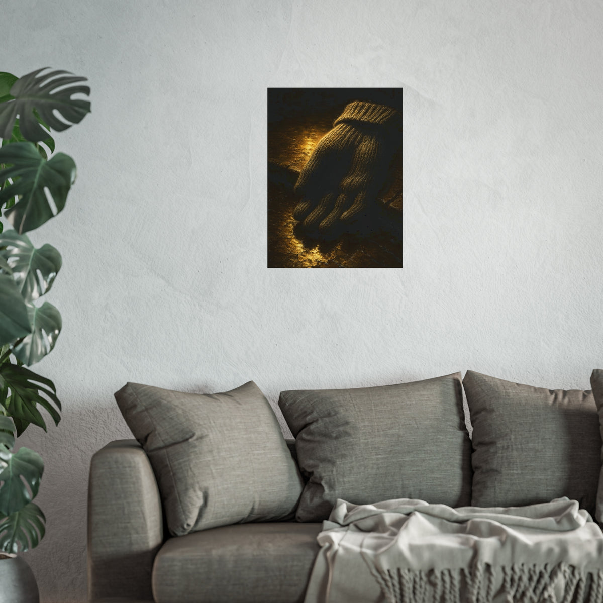 A knitted wool glove palm down on wet stone in gold light. The Presentation of the Woolen Glove by Garabaggio, fine art print hanging in a room.