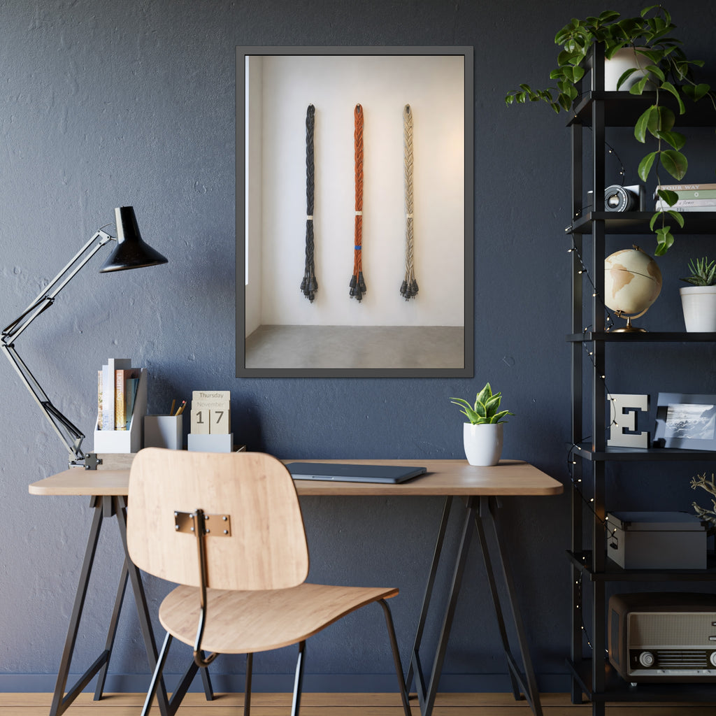 Three braided bundles of extension cords hung on a white gallery wall. The Braided Triptych by Garabaggio, framed fine art print hanging in a room.