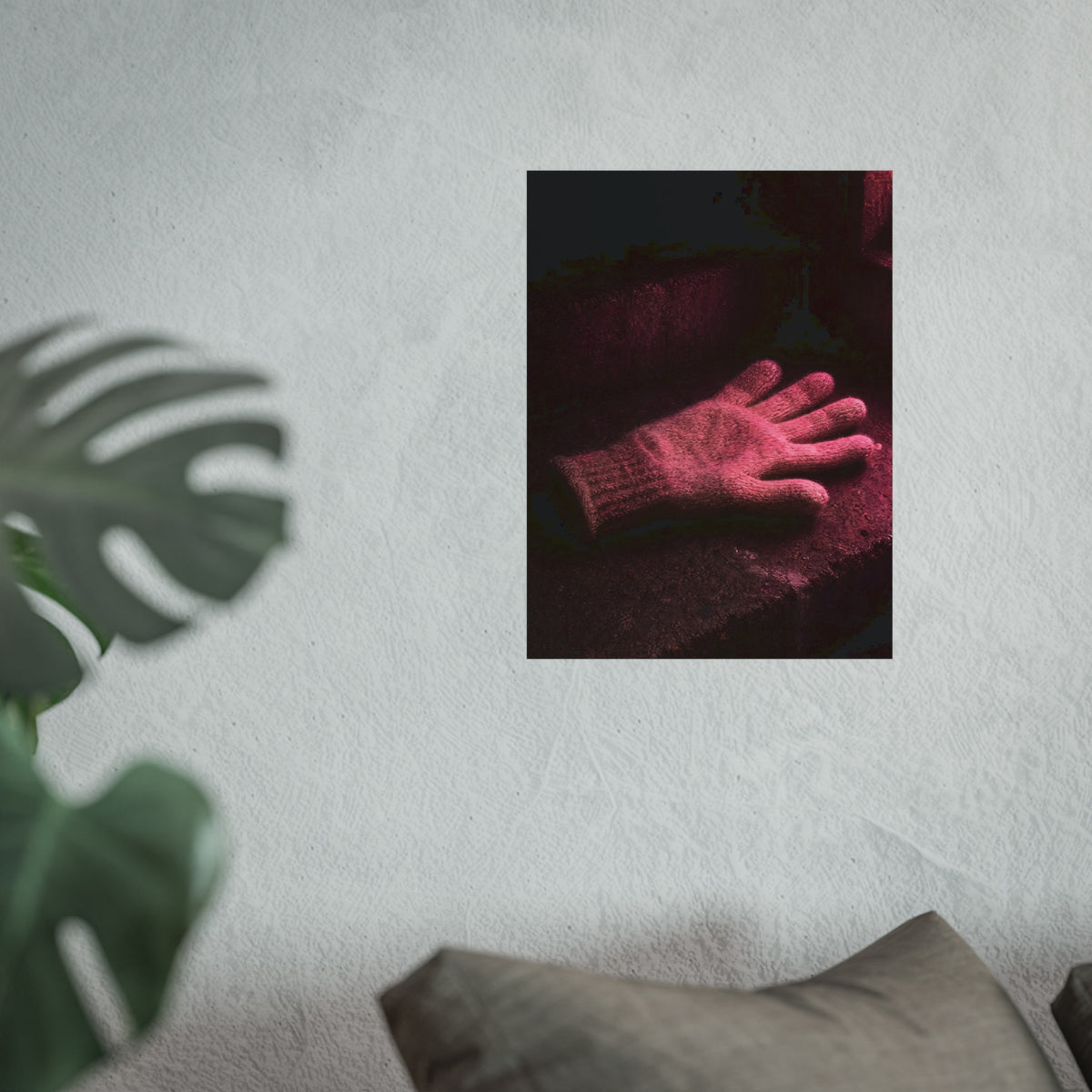 A knitted glove lying flat on a concrete step under pink light. The Vigil in Pink Light by Garabaggio, fine art print hanging in a room.