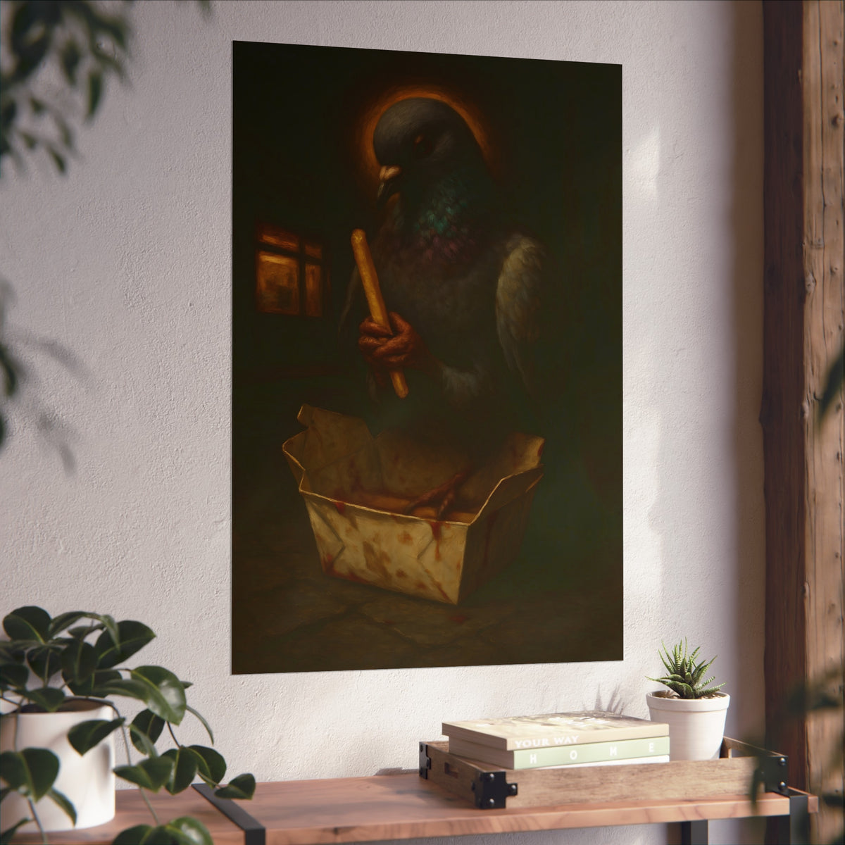 A haloed pigeon holding a french fry over a takeout carton in an alley. Madonna of the Pigeon with Fries by Garabaggio, fine art print hanging in a room.