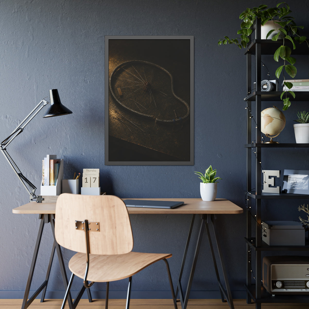 A bent bicycle wheel rim with loose spokes on a dark table in warm light. The Cutting of the Circle by Garabaggio, framed fine art print hanging in a room.