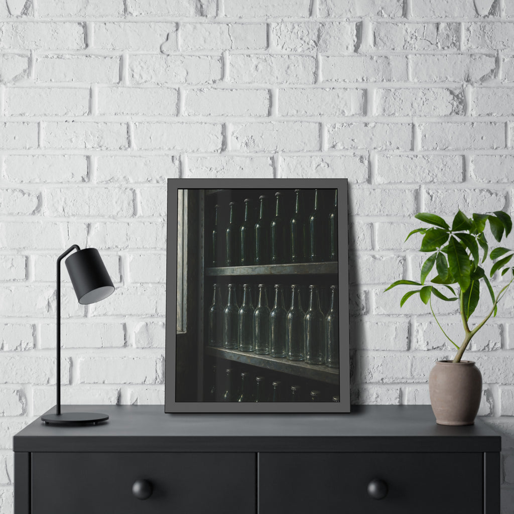 Rows of empty bottles on dim metal shelves, green above and clear below. The Shelf of New Bottles by Garabaggio, framed fine art print hanging in a room.