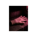A knitted glove lying flat on a concrete step under pink light. The Vigil in Pink Light by Garabaggio, fine art print, 12″ x 16″.