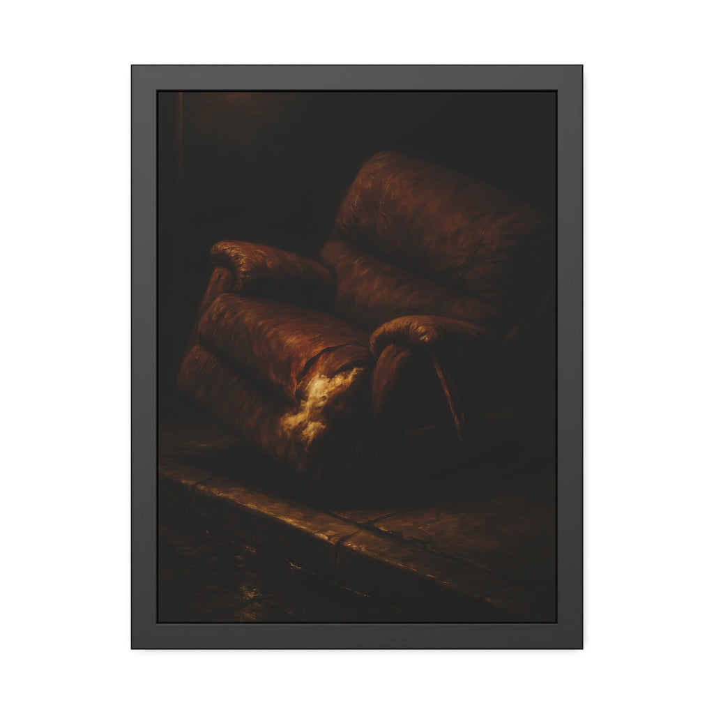 A torn brown recliner tipped on a curb in dim warm light. The Deposition of the Broken Recliner by Garabaggio, framed fine art print hanging in a room.