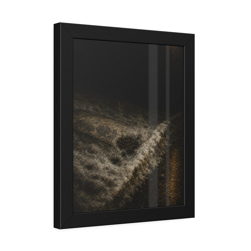 A discarded mattress half buried in snow, a distant streetlight behind. The White Burial by Garabaggio, framed fine art print hanging in a room.