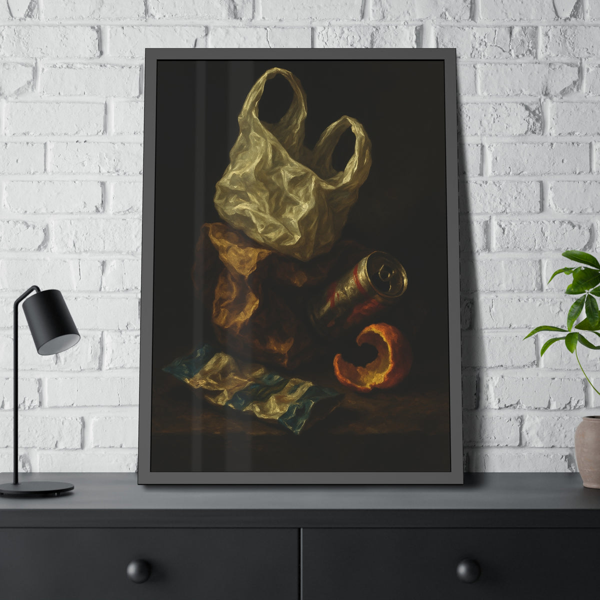 A plastic bag, crushed can and orange peel on a dim table. Still Life with Orange Peel and Resignation by Garabaggio, framed fine art print hanging in a room.