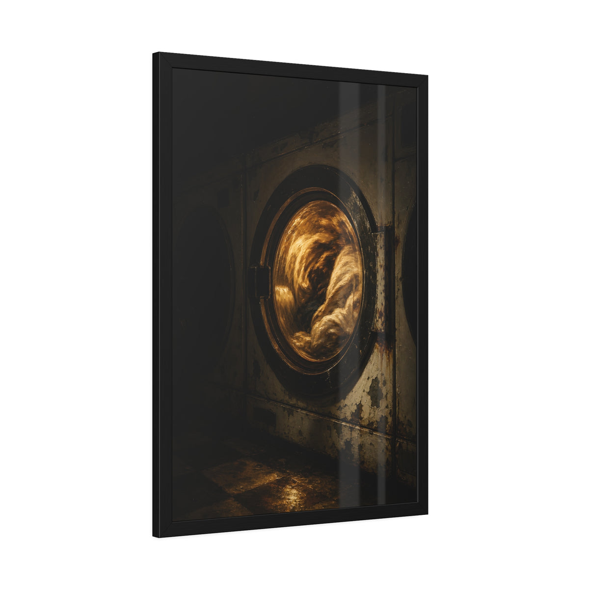 A washer drum tumbling laundry lit amber behind its glass door. The First Spin by Garabaggio, framed fine art print hanging in a room.