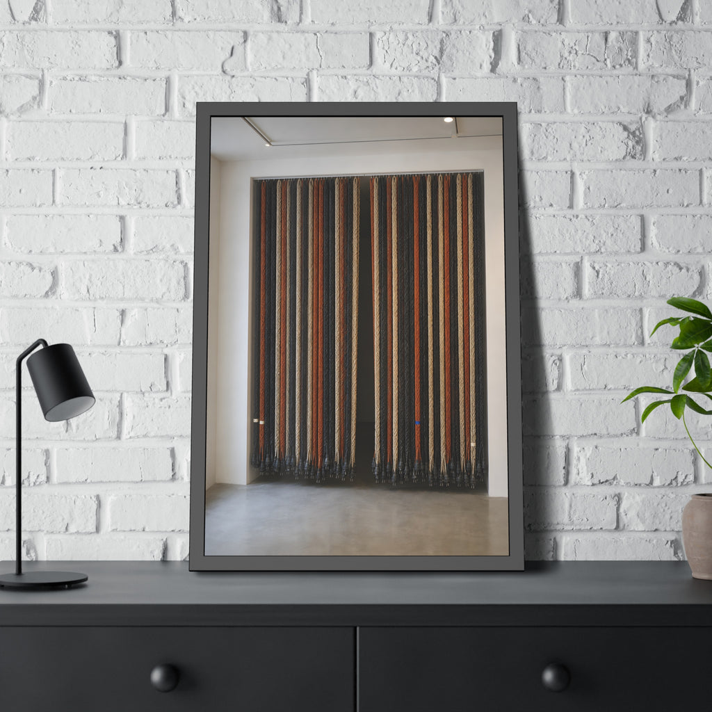 Hundreds of extension cords hung floor to ceiling across a bright white room. The Cord Curtain by Garabaggio, framed fine art print hanging in a room.