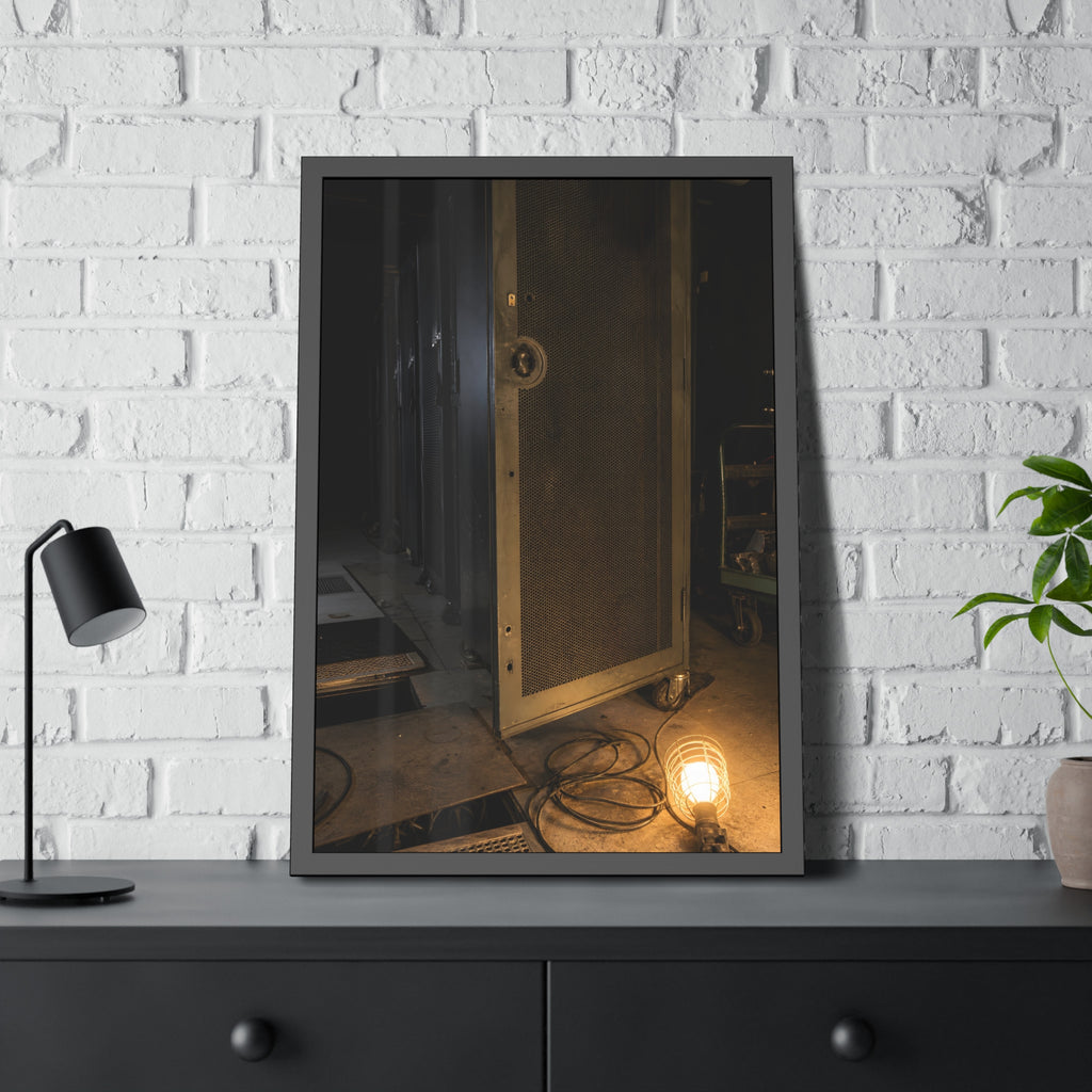 A perforated server rack door in a dark aisle lit by a floor work lamp. The Cold Aisle by Garabaggio, framed fine art print hanging in a room.