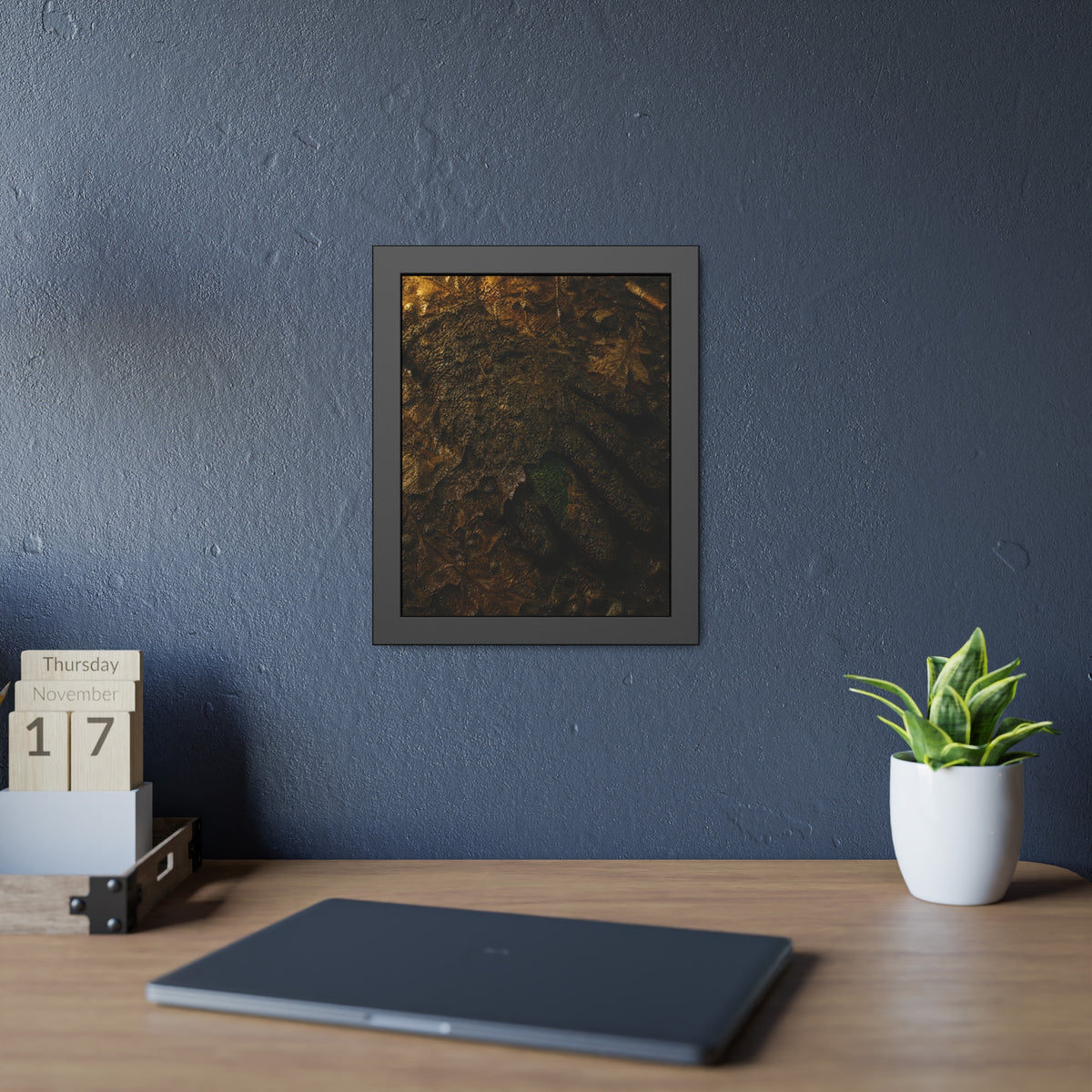 Wet mud and pressed oak leaves with a green scrap barely showing. The Reliquary of Mud and Leaf by Garabaggio, framed fine art print hanging in a room.