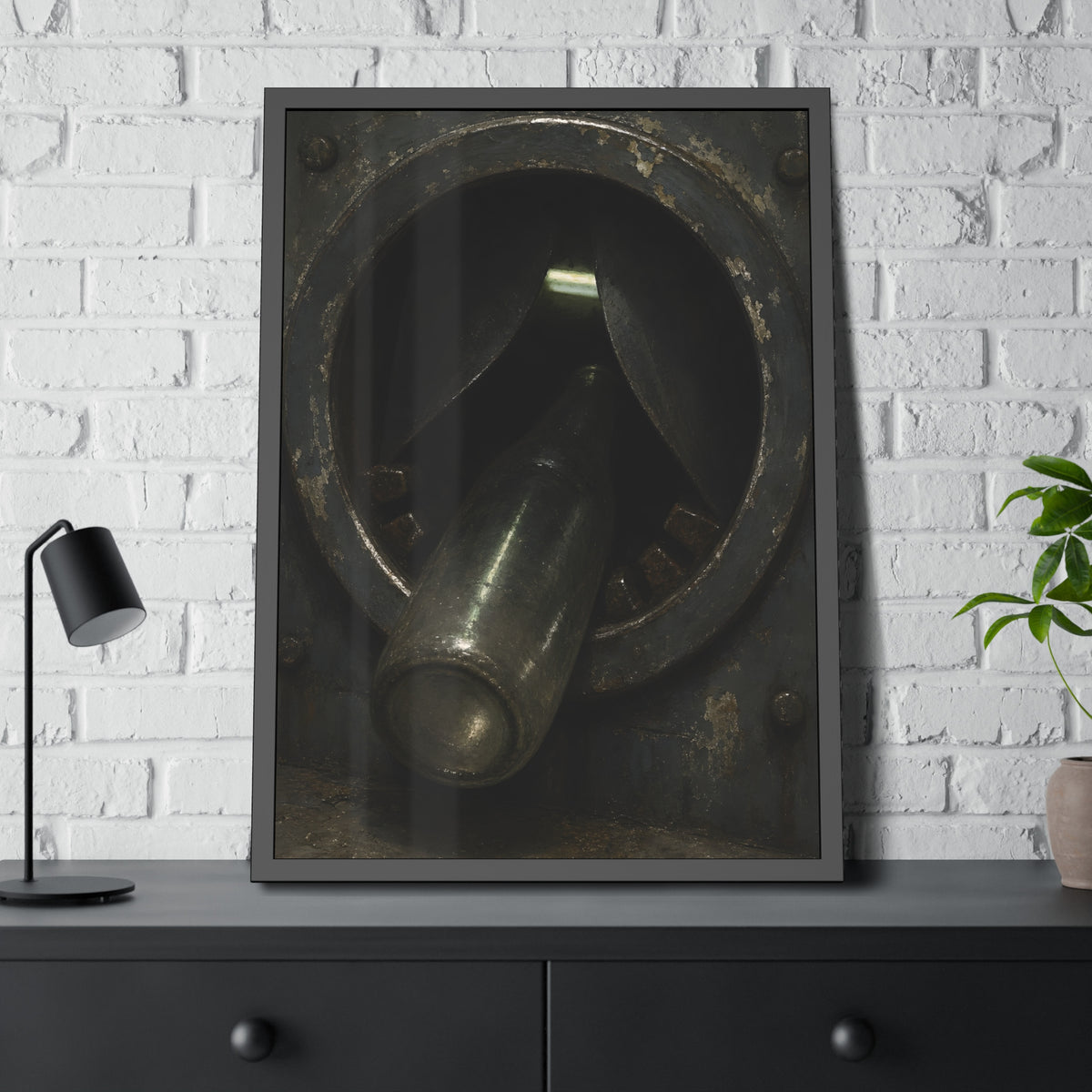 A glass bottle wedged in the round steel intake of a crushing machine. The Crusher's Mouth by Garabaggio, framed fine art print hanging in a room.