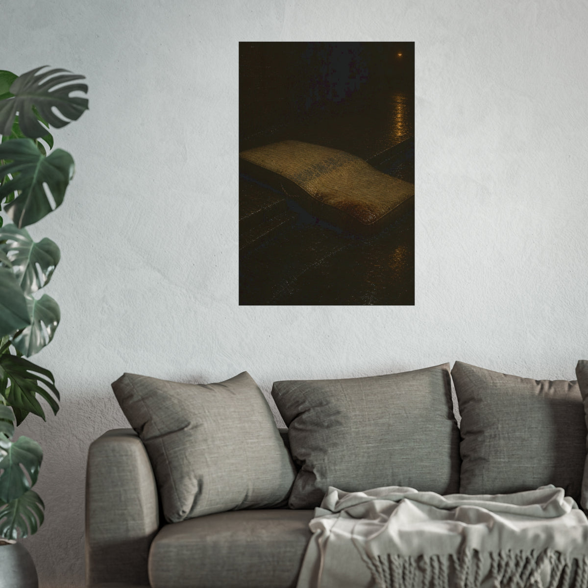 A sodden mattress slumped off a curb on wet pavement under a street lamp. The Collapse into the Gutter by Garabaggio, fine art print hanging in a room.