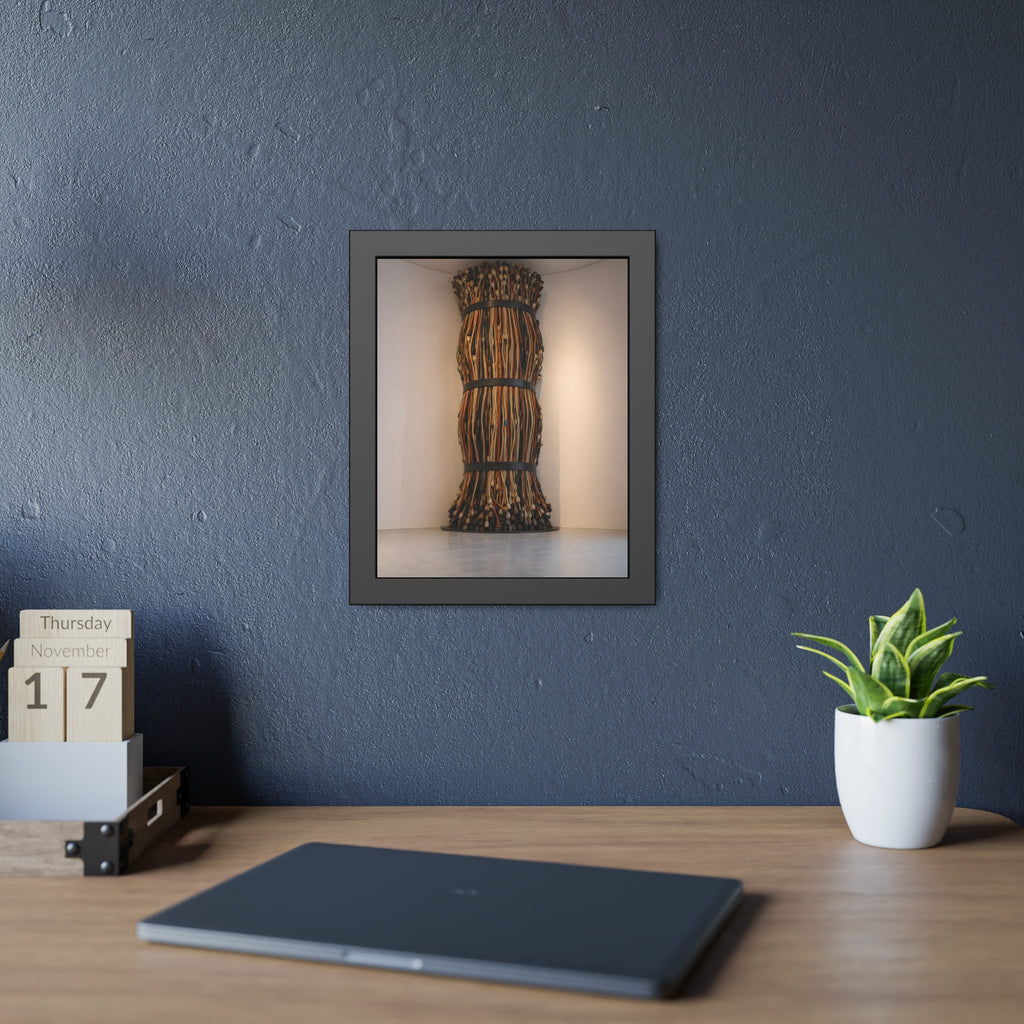 A tall column of bundled cords strapped in three places in a gallery corner. The Bundled Apse by Garabaggio, framed fine art print hanging in a room.
