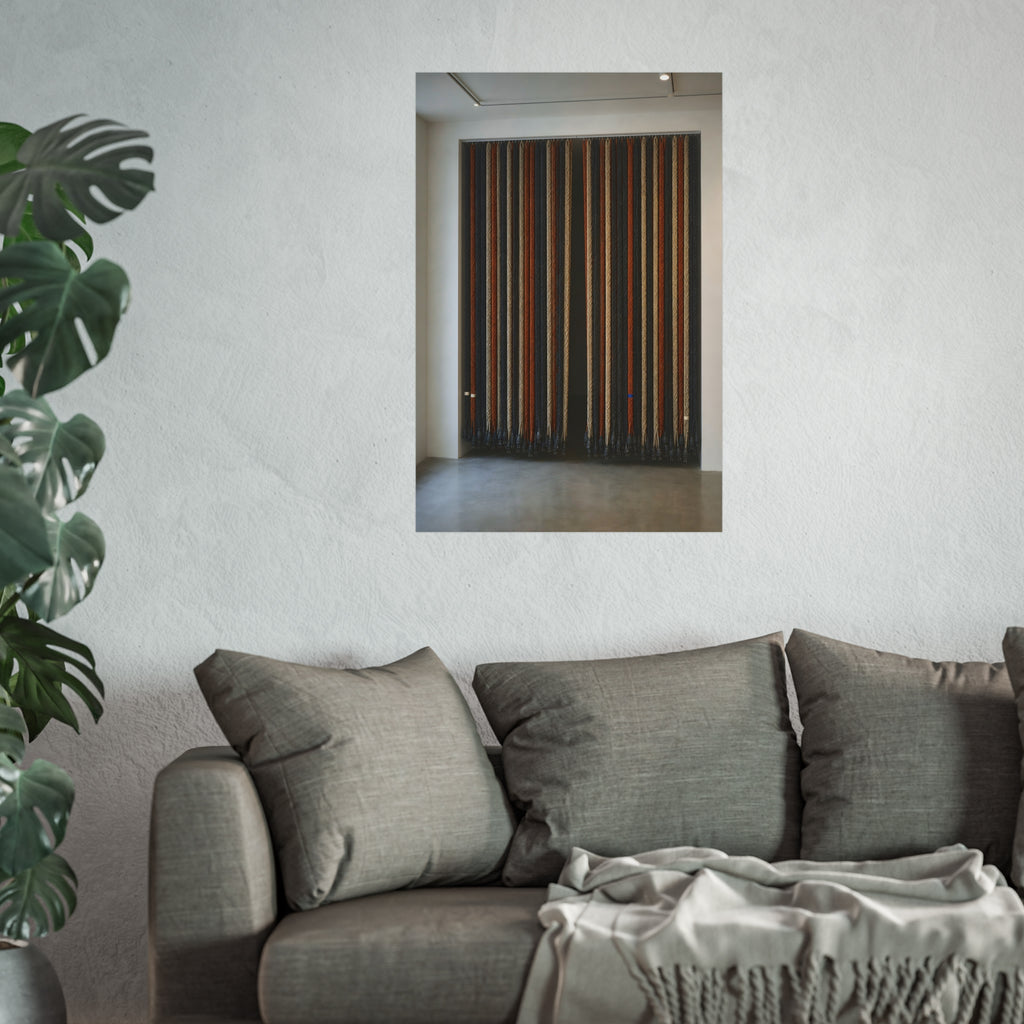 Hundreds of extension cords hung floor to ceiling across a bright white room. The Cord Curtain by Garabaggio, fine art print hanging in a room.