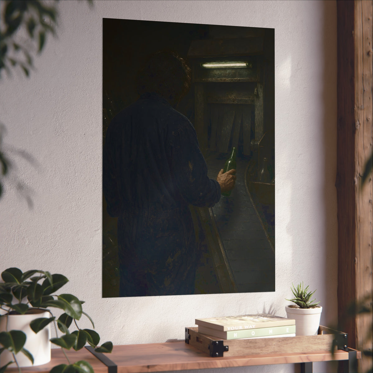 A man in coveralls sets a green bottle on a conveyor under a strip light. Garabaggio at the Conveyor by Garabaggio, fine art print hanging in a room.
