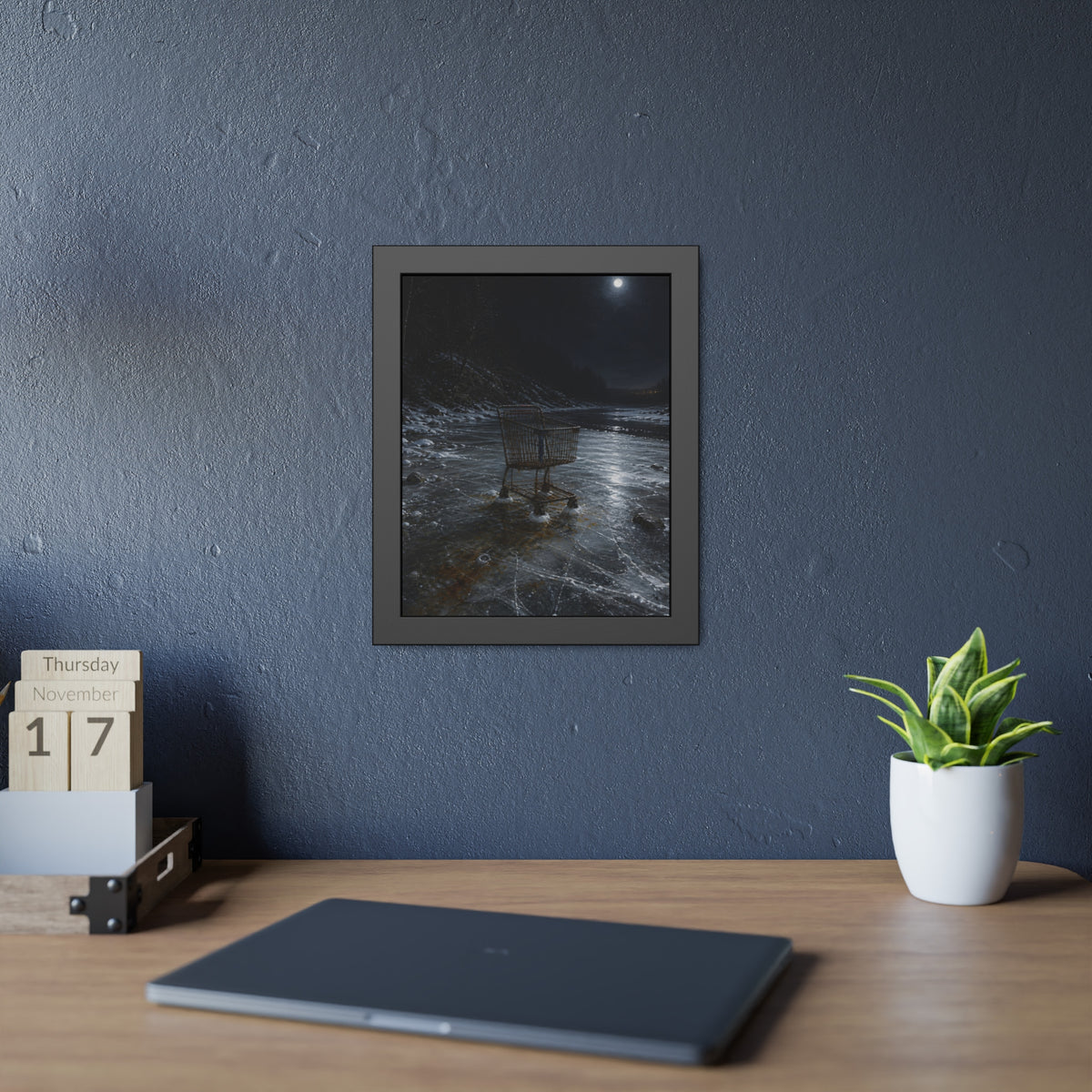 A rusted shopping cart frozen into moonlit river ice. The Wintering in the Ice by Garabaggio, framed fine art print hanging in a room.