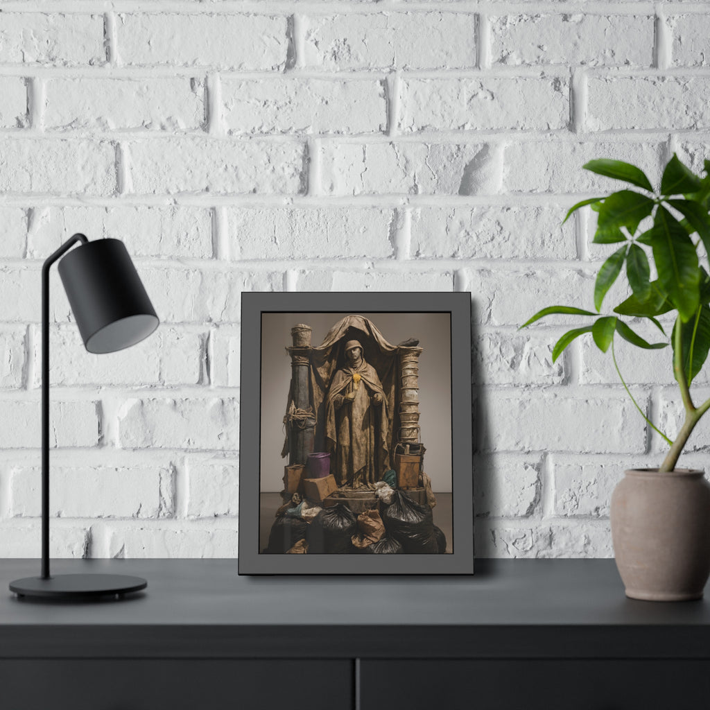 Draped standing figure under a canopy above a heap of black garbage bags. Saint Francis of the Black Bag by Garabaggio, framed fine art print hanging in a room.
