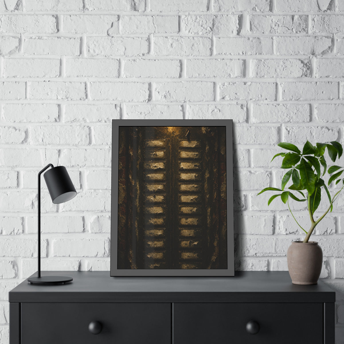 An apartment intercom panel with blank nameplates, lit from above. The Labels Removed by Garabaggio, framed fine art print hanging in a room.